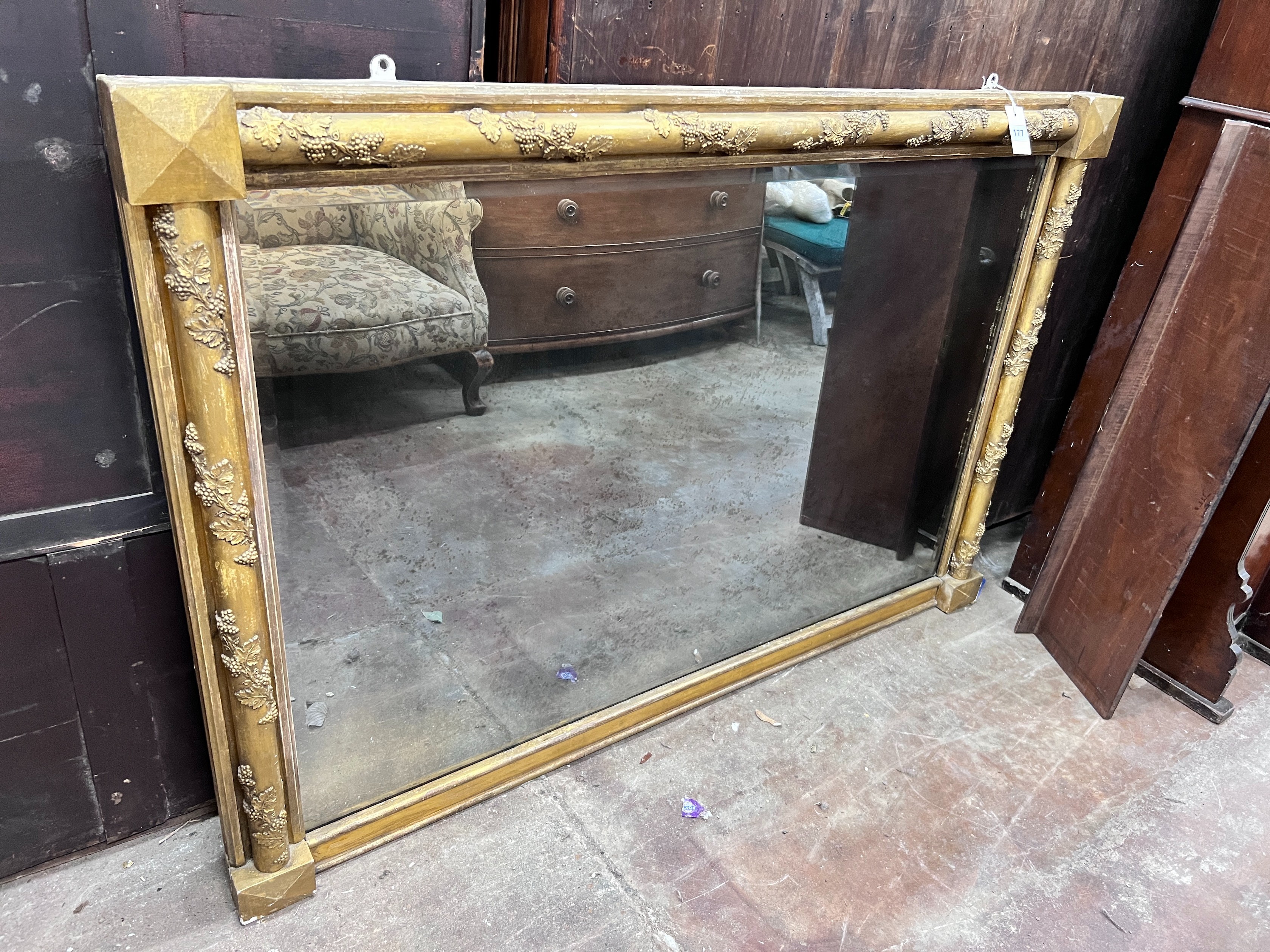 A Victorian gilt gesso and carved wood wall mirror, with vineous scroll borders, width 141cm, height 95cm *Please note the sale commences at 9am.